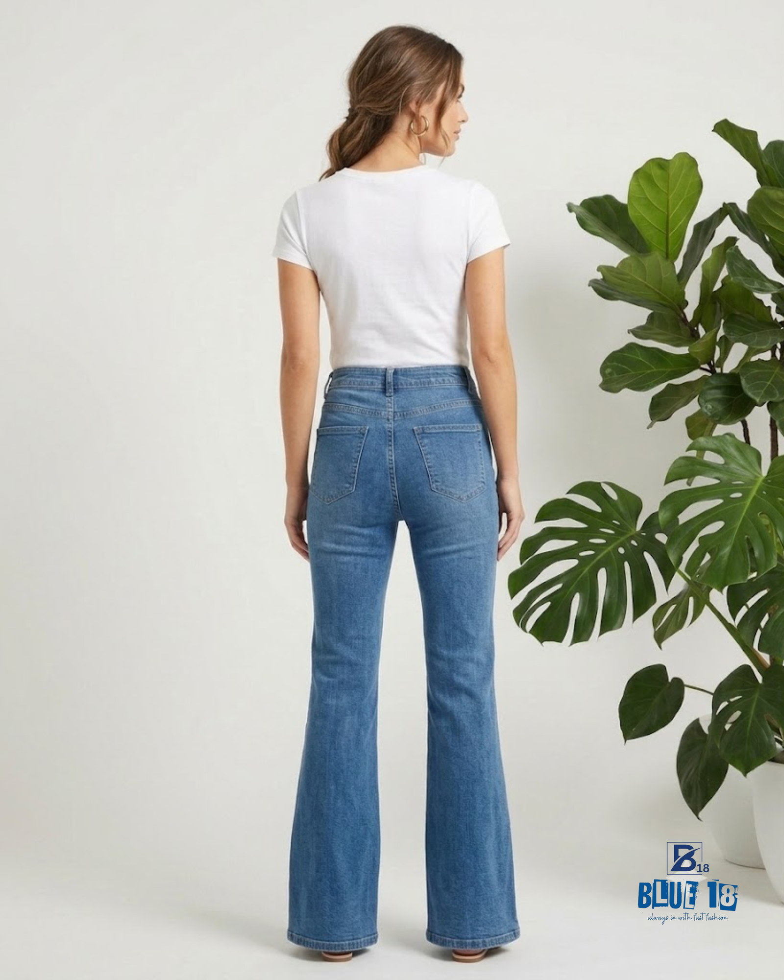 Women’s Mid Blue Flared Jeans with Bottom Button Detail